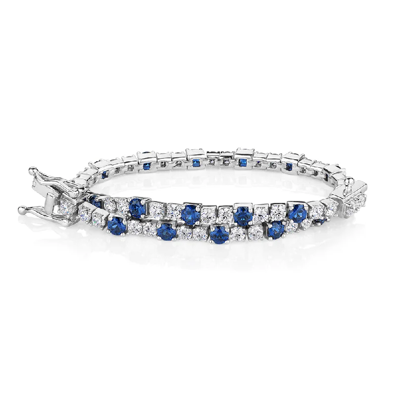 Round Brilliant tennis bracelet with sapphire simulants and 3.28 carats* of diamond simulants in sterling silver